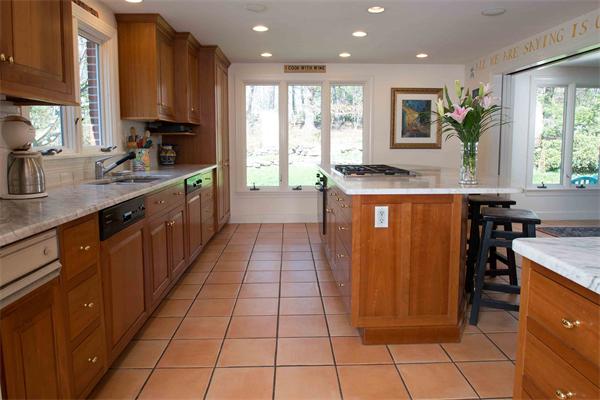 15 West Knoll Road Andover, MA 01810 - Photo 9 of 15 a large kitchen with stainless steel appliances a sink counter space and a window