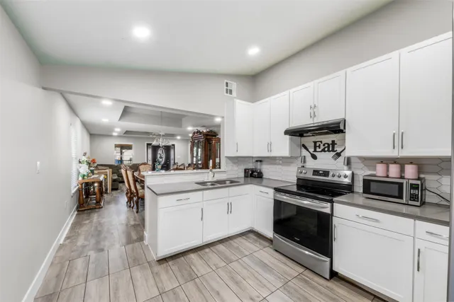 a view of a hallway view with staircase