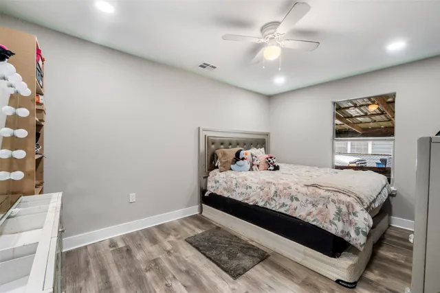 a bathroom with a sink a toilet a mirror and shower