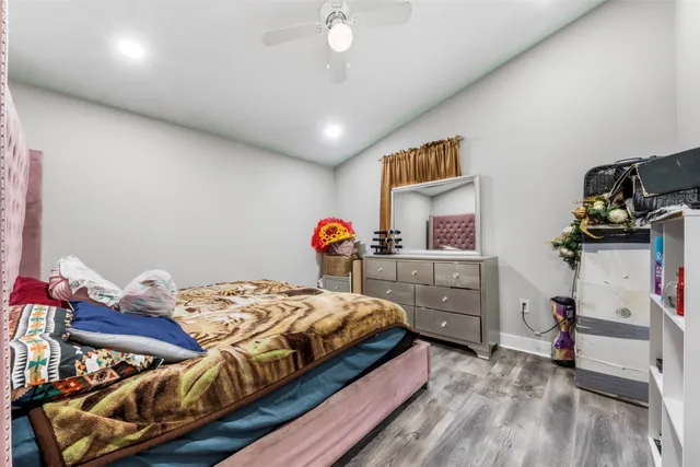a bathroom with a sink mirror vanity and toilet