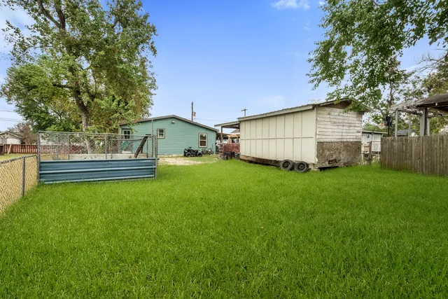 a backyard of a house with bicycles parked