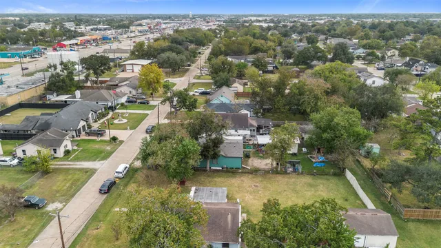 an aerial view of residential house with outdoor space and parking