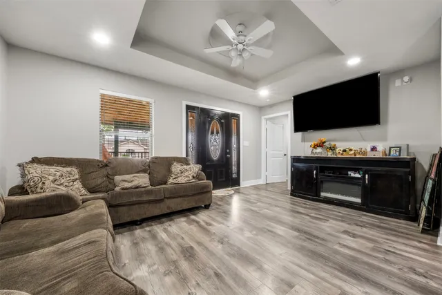 a living room with furniture and white walls