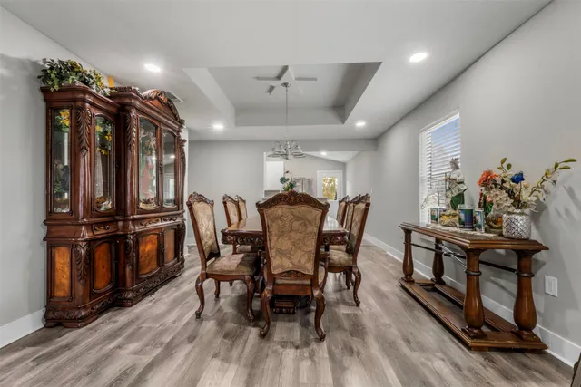 a dining room with furniture and window