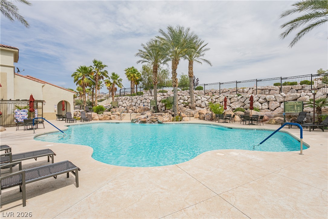 2555 Hampton Road, Unit 3308 Henderson, NV 89052 - Photo 63 of 65 A tranquil oasis featuring a resort-style pool with cascading water features and ample lounging areas.