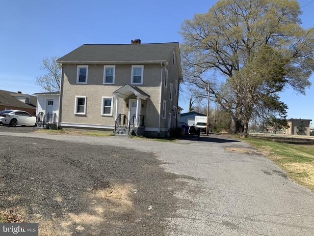 3025 Old Washington Road Waldorf, MD 20601 - Photo 1 of 7 a front view of a house with a yard