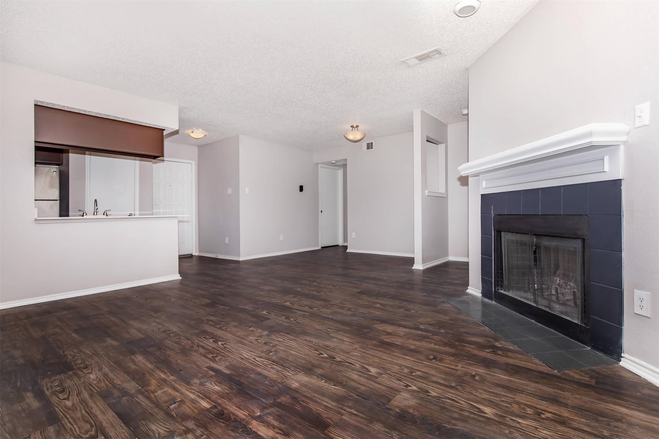 8301 Boat Club Road, Unit 1425 Fort Worth, TX 76179 - Photo 3 of 44 a view of a livingroom with wooden floor and a fireplace