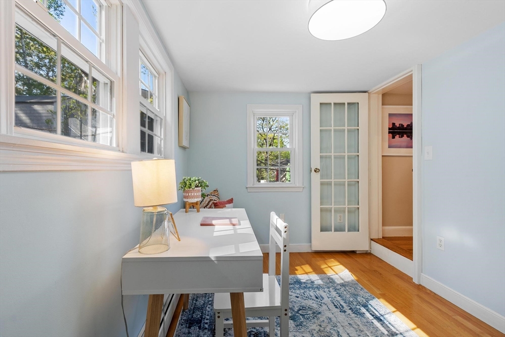 25 Naples Road Melrose, MA 02176 - Photo 8 of 36 a view of a workspace with furniture and a window