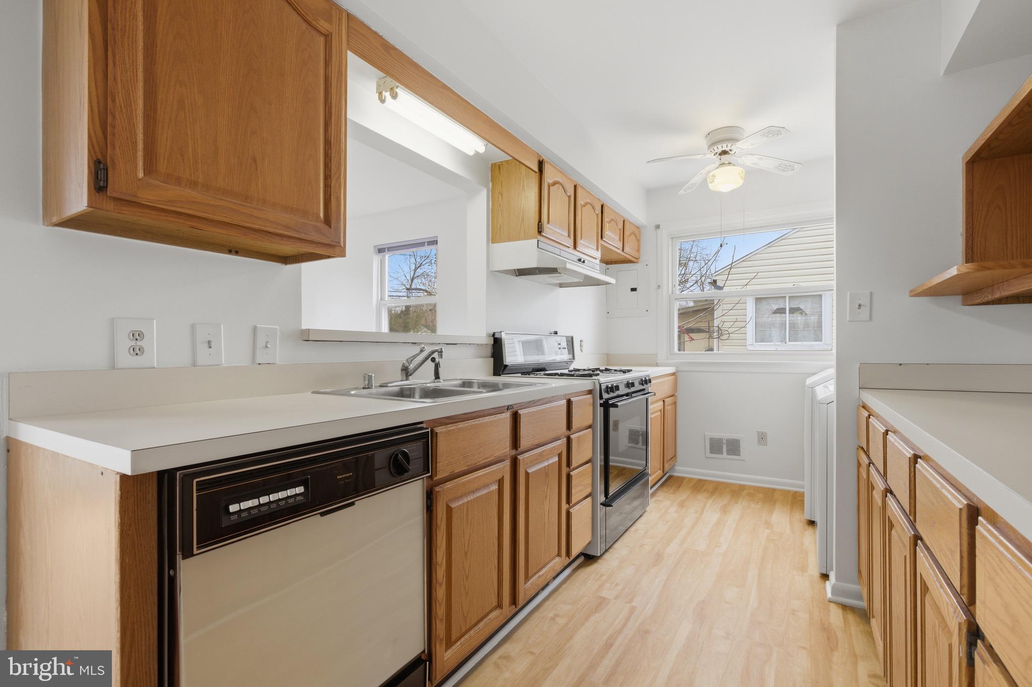 1004 Marton Street Laurel, MD 20707 - Photo 16 of 24 a kitchen with a sink stove and cabinets