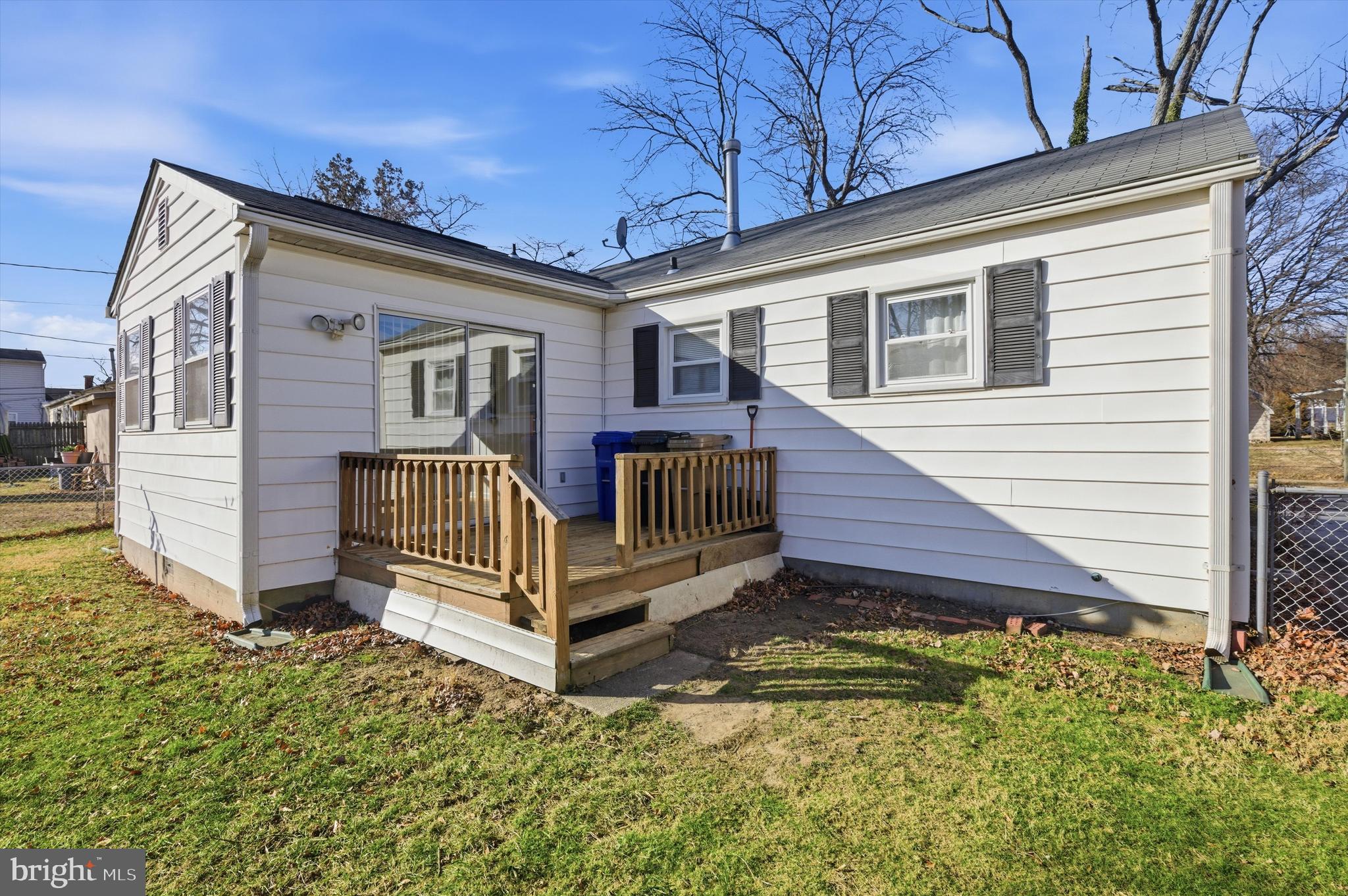 1004 Marton Street Laurel, MD 20707 - Photo 21 of 21 a view of a house with a small yard and wooden fence