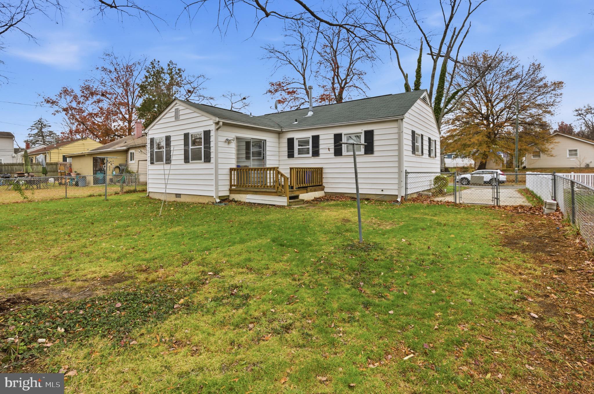 1004 Marton Street Laurel, MD 20707 - Photo 22 of 24 a front view of a house with a yard