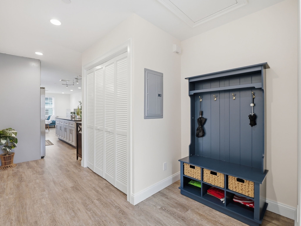 149 Pleasant Street, Unit 2 Marblehead, MA 01945 - Photo 14 of 41 a room with furniture and wooden floor