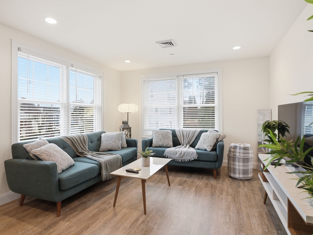 149 Pleasant Street, Unit 2 Marblehead, MA 01945 - Photo 2 of 41 a living room with furniture and a large window