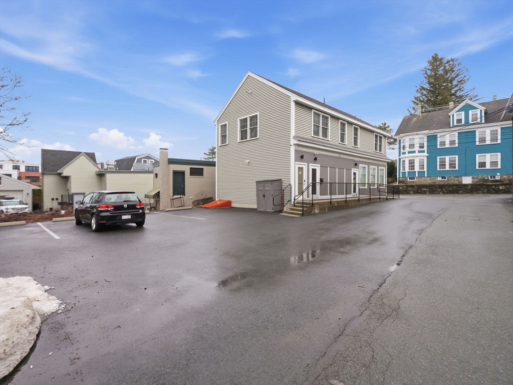 149 Pleasant Street, Unit 2 Marblehead, MA 01945 - Photo 33 of 41 a view of a car park in front of a building