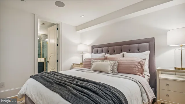 a bathroom with a double vanity sink mirror and shower