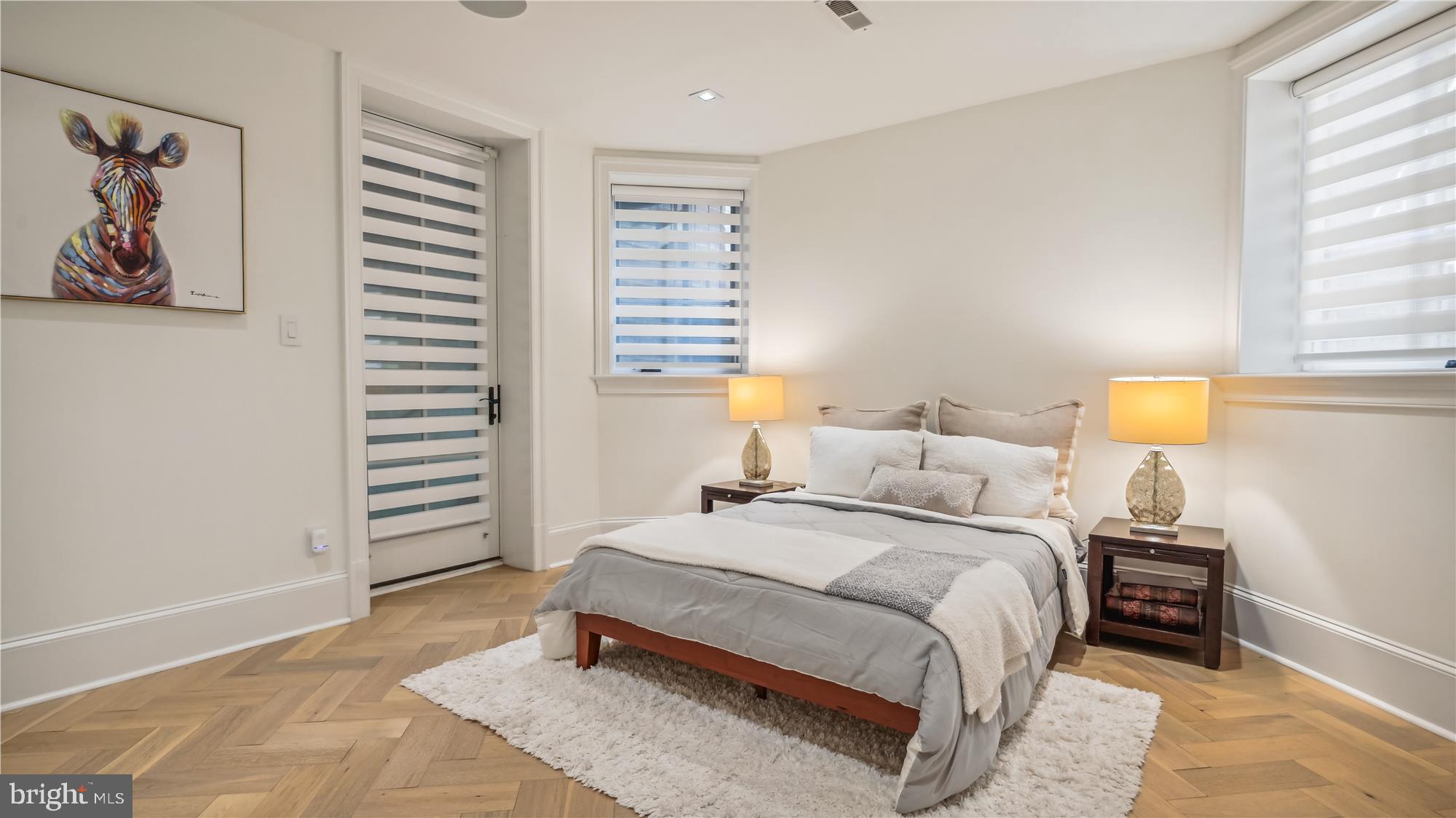 1832 16th Street Northwest, Unit 1 Washington, DC 20009 - Photo 20 of 25 a bedroom with a bed and a night stand