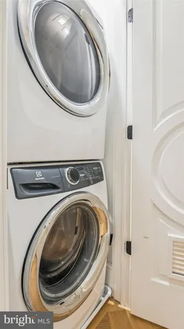 a front view of a multi story residential apartment building with a yard