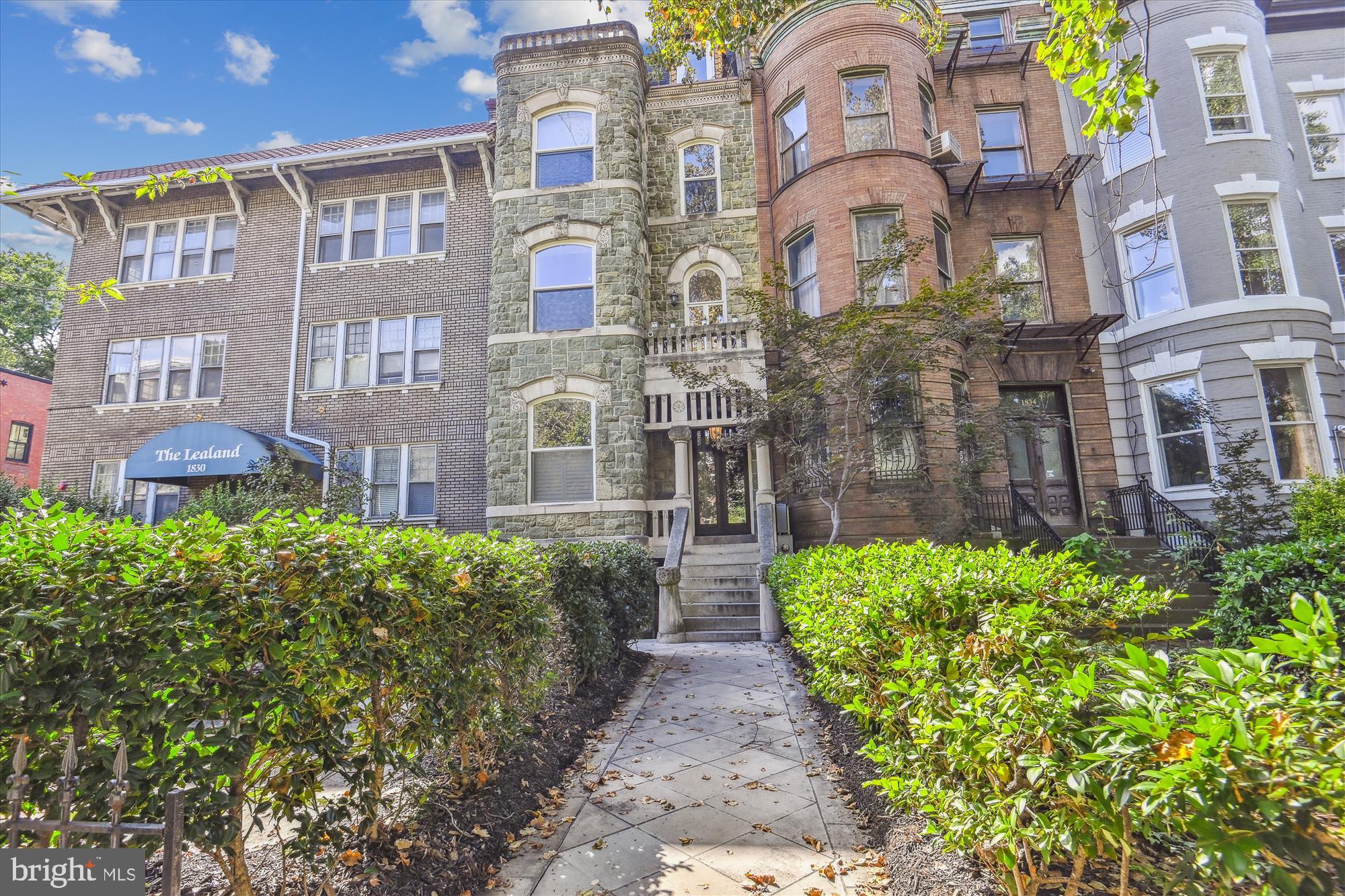 1832 16th Street Northwest, Unit 1 Washington, DC 20009 - Photo 24 of 25 a front view of a multi story residential apartment building with a yard