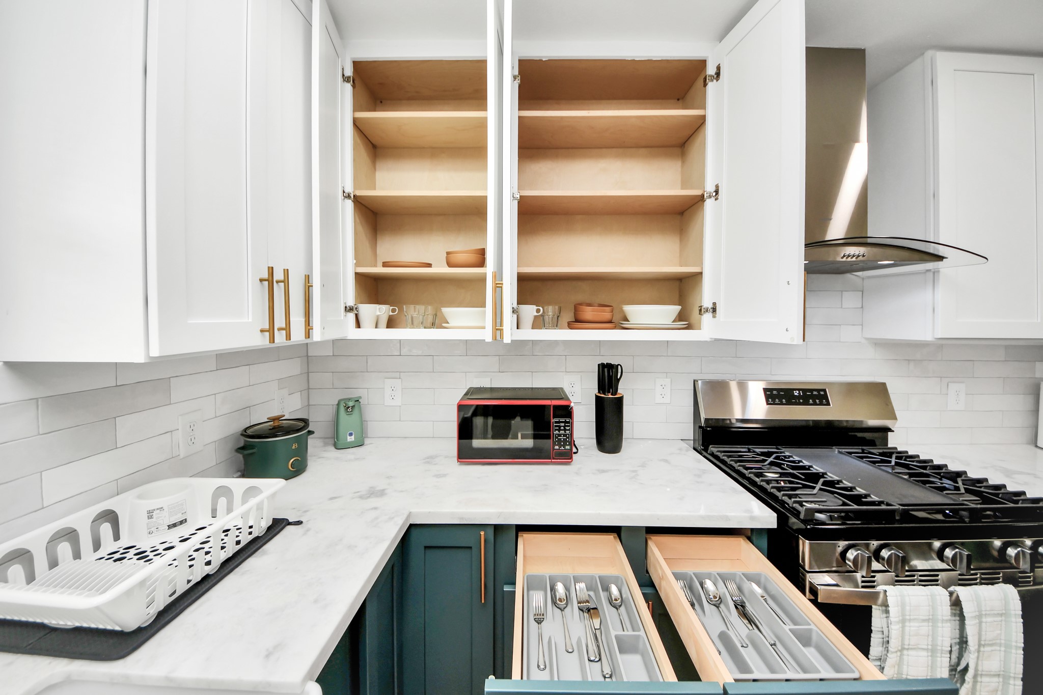 5115 Clay Street Houston, TX 77023 - Photo 15 of 43 a kitchen with stainless steel appliances granite countertop a stove and a sink