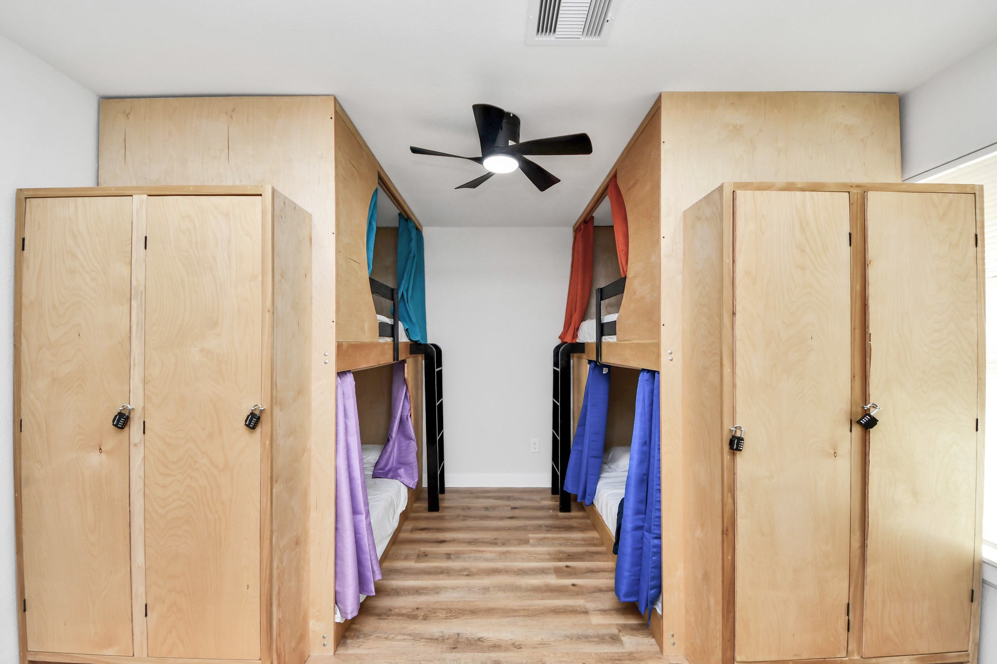 5115 Clay Street Houston, TX 77023 - Photo 19 of 43 a view of a hallway with wooden floor and staircase
