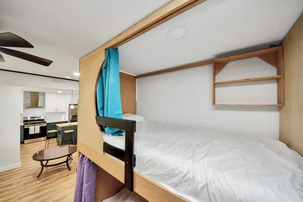 a bedroom with a bed and window