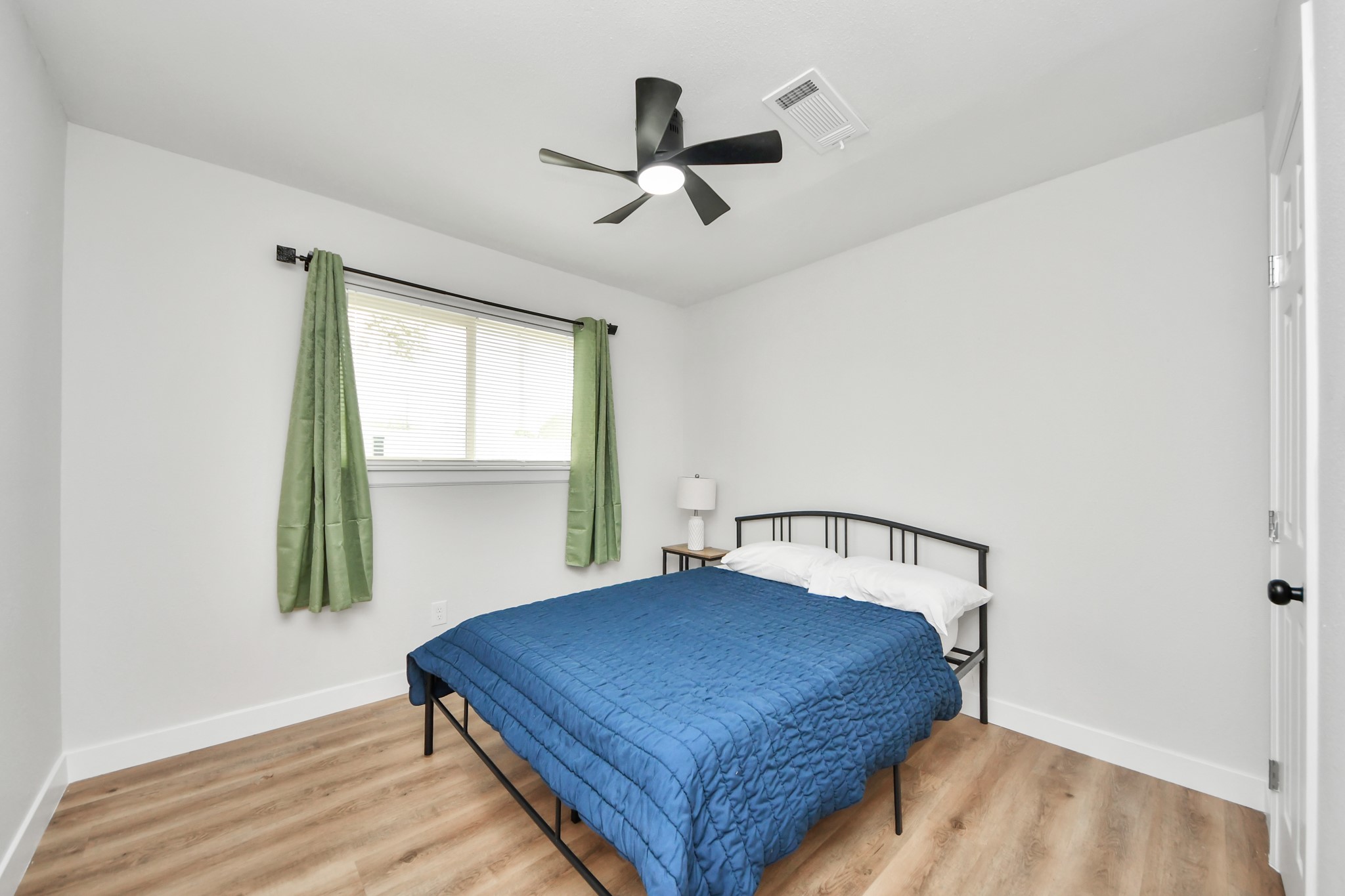 5115 Clay Street Houston, TX 77023 - Photo 24 of 43 a bedroom with a bed and window