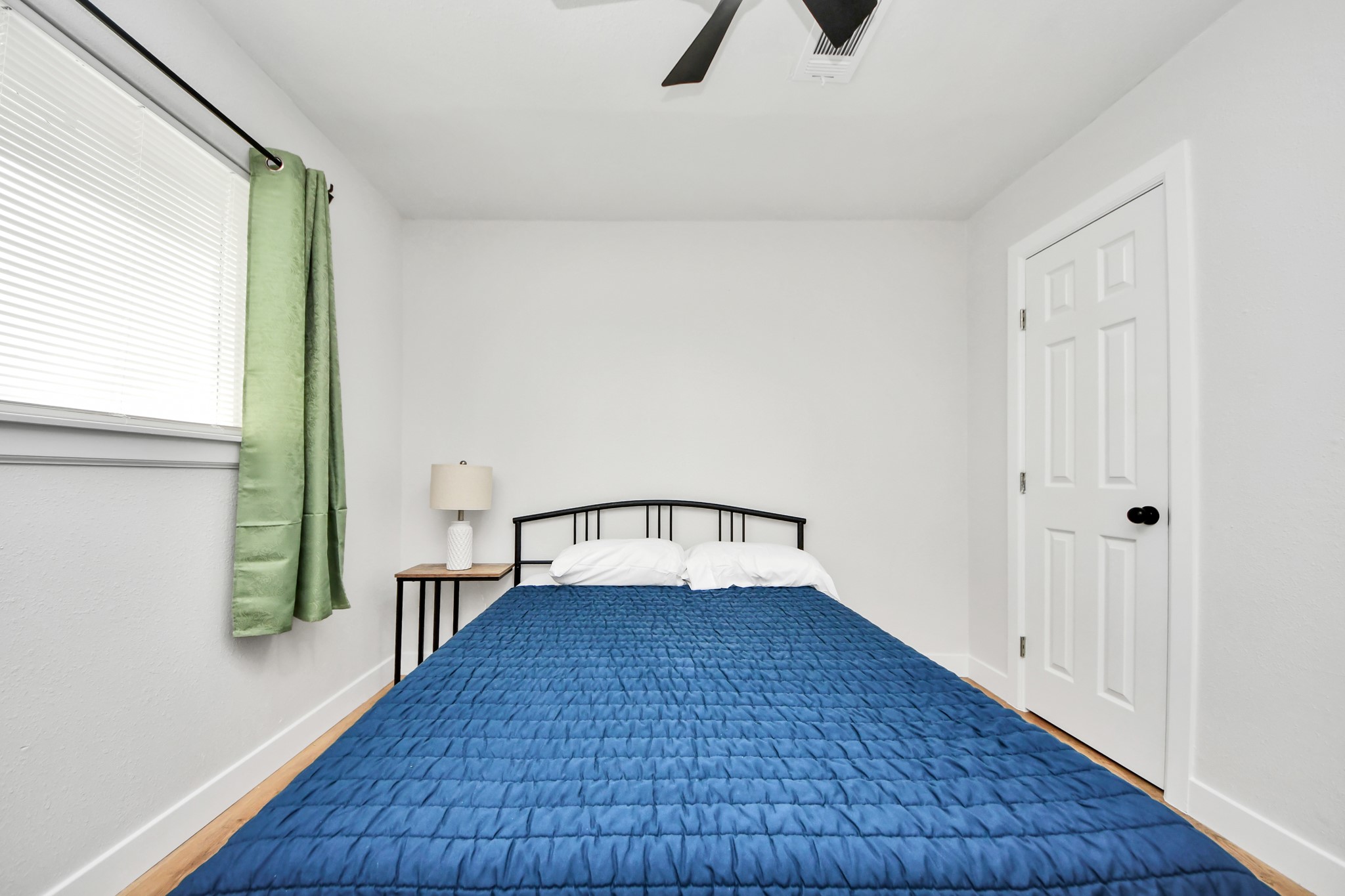 5115 Clay Street Houston, TX 77023 - Photo 27 of 43 wooden floor in an empty room with a window