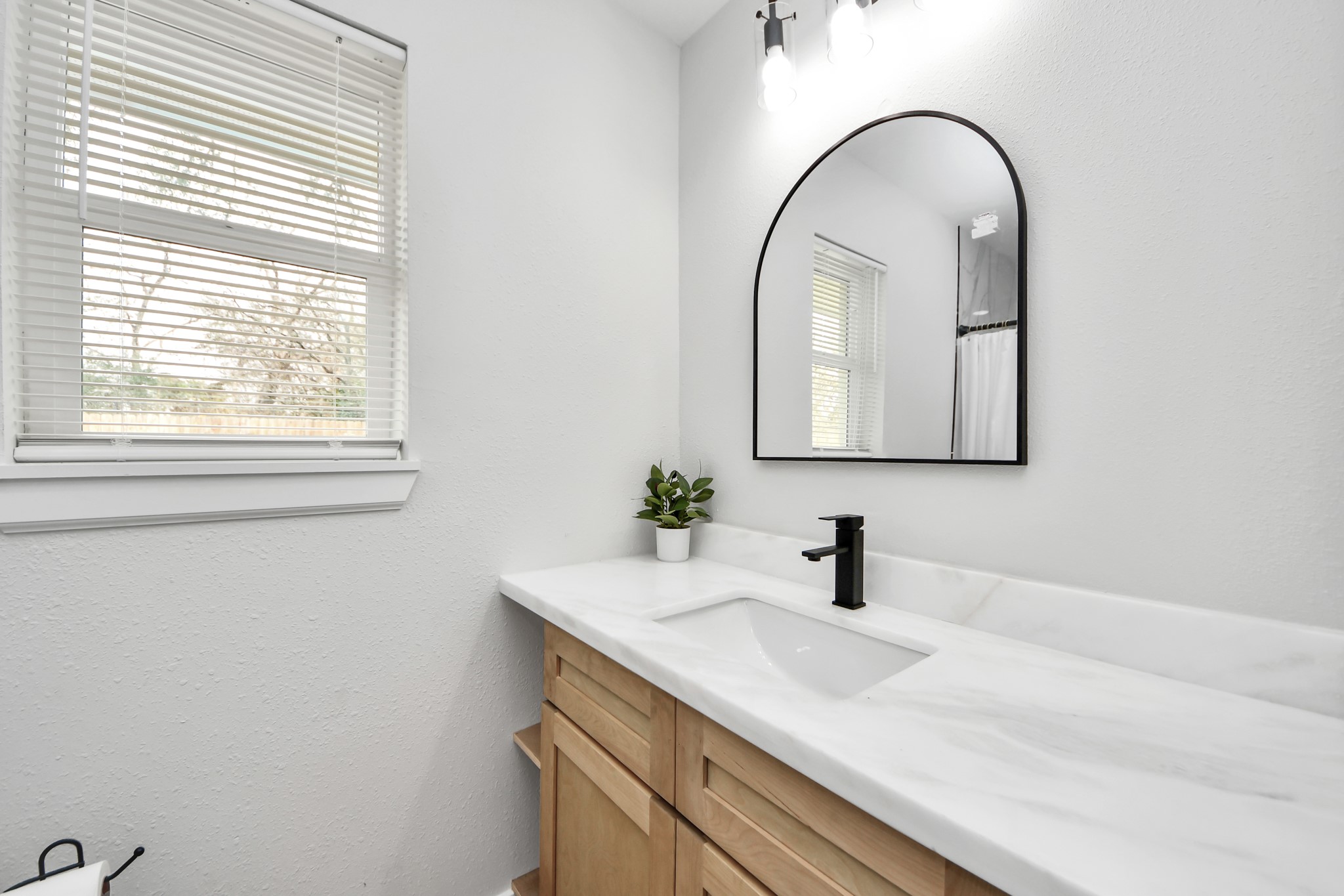 5115 Clay Street Houston, TX 77023 - Photo 29 of 43 a bathroom with a sink and a mirror