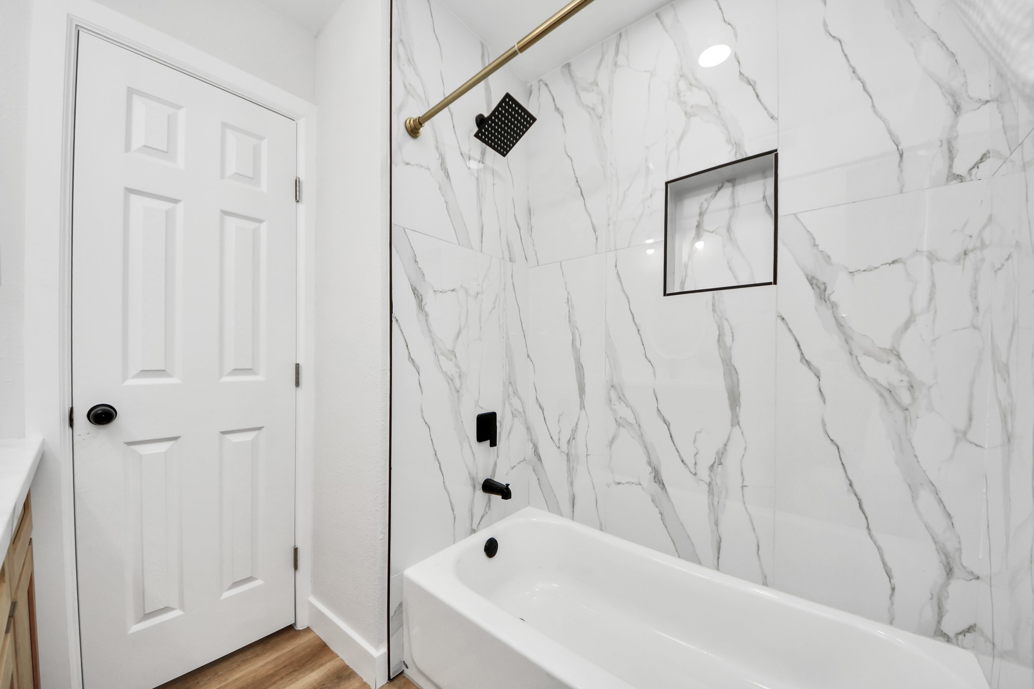 5115 Clay Street Houston, TX 77023 - Photo 37 of 43 a bathroom with a bathtub and shower