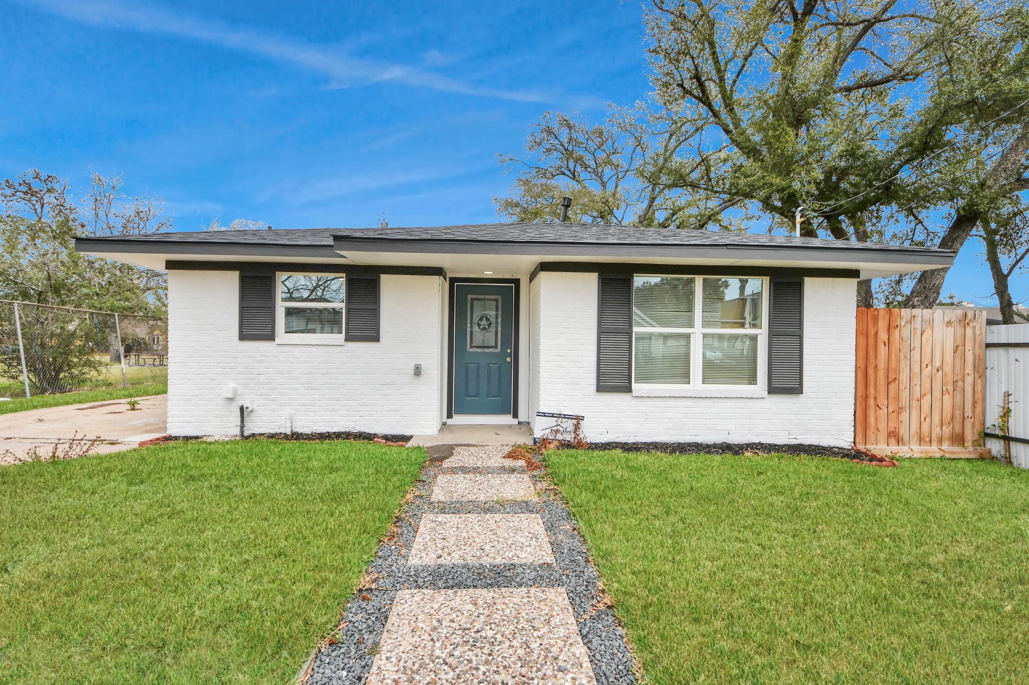 5115 Clay Street Houston, TX 77023 - Photo 42 of 43 a front view of a house with a yard