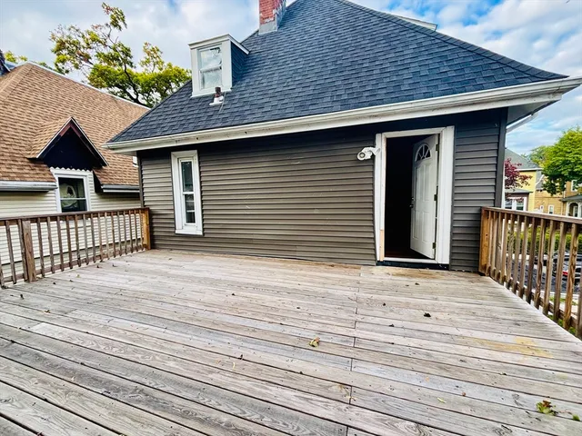a view of deck with wooden floor and outdoor seating