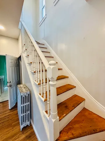 a view of a room with wooden floor and small space