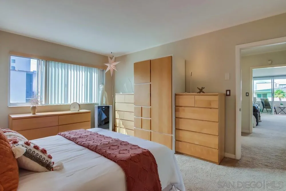 2701 2nd Avenue, Unit 201 San Diego, CA 92103 - Photo 29 of 39 a bedroom with a bed and a dresser