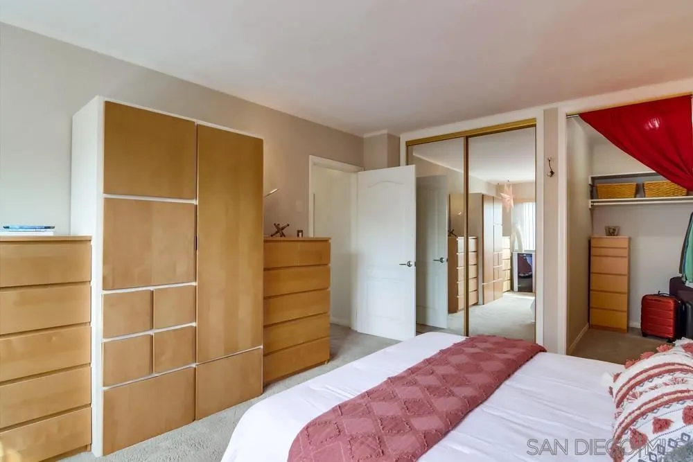 2701 2nd Avenue, Unit 201 San Diego, CA 92103 - Photo 31 of 39 a bedroom with a bed and a cabinets