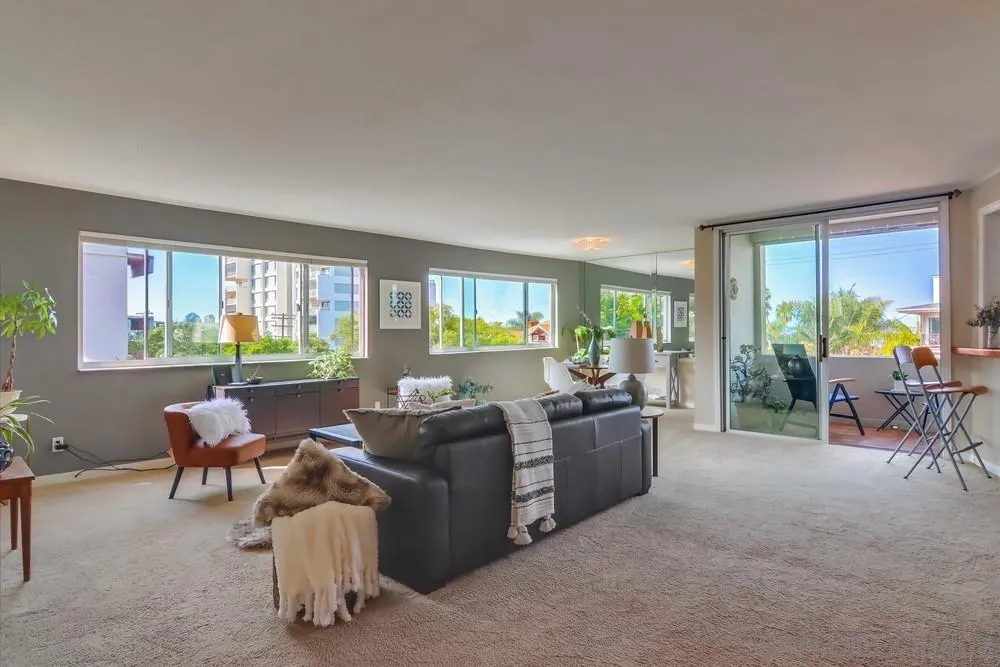 2701 2nd Avenue, Unit 201 San Diego, CA 92103 - Photo 5 of 39 a living room with furniture and a large window