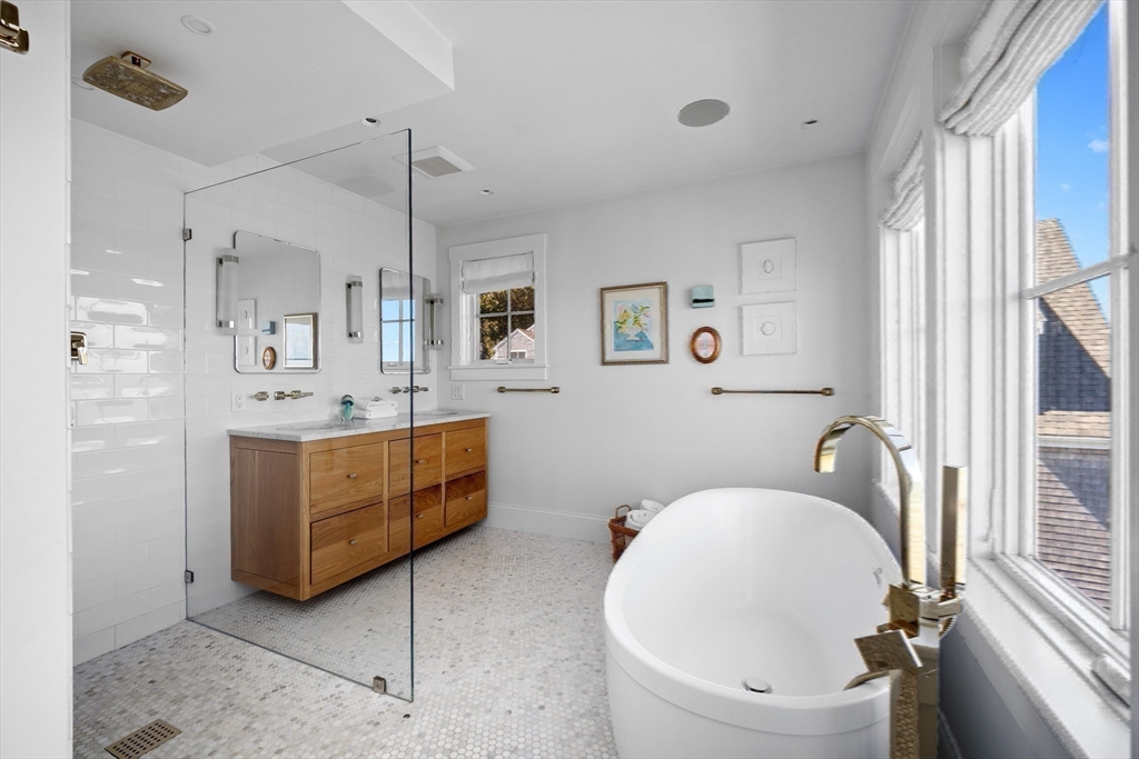 93 Kimball Beach Road Hingham, MA 02043 - Photo 14 of 36 a bathroom with a tub sink and mirror