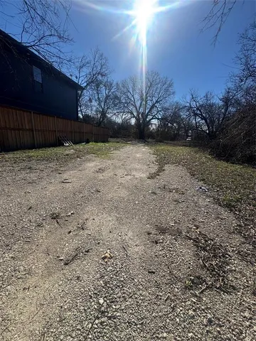 a view of a backyard with trees