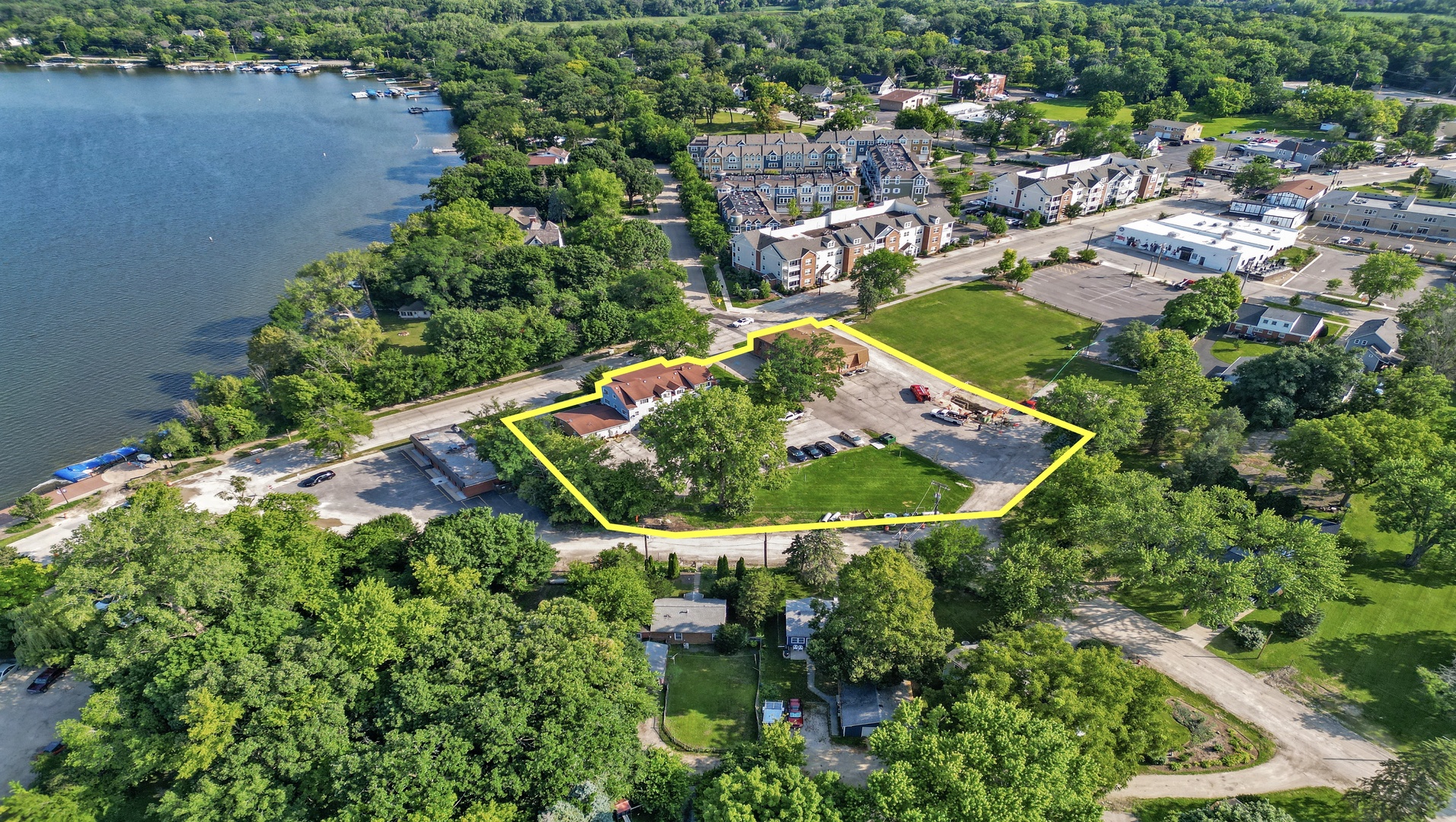 an aerial view of residential house with outdoor space and swimming pool