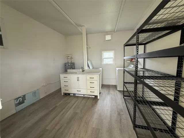 a room with stairs and wooden floor
