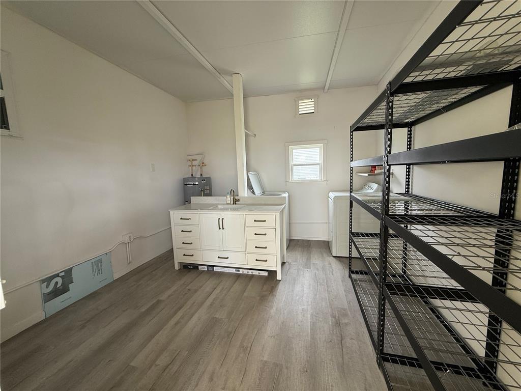 637 Los Altos, Unit 374 North Port, FL 34287 - Photo 19 of 26 a room with stairs and wooden floor