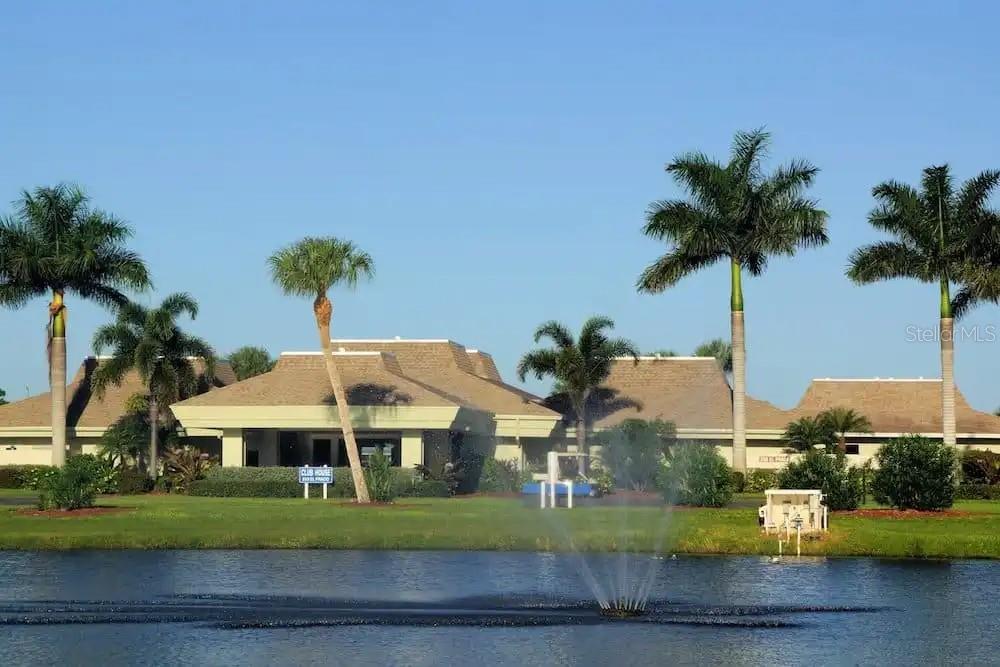 637 Los Altos, Unit 374 North Port, FL 34287 - Photo 25 of 26 a front view of a house with a garden and plants