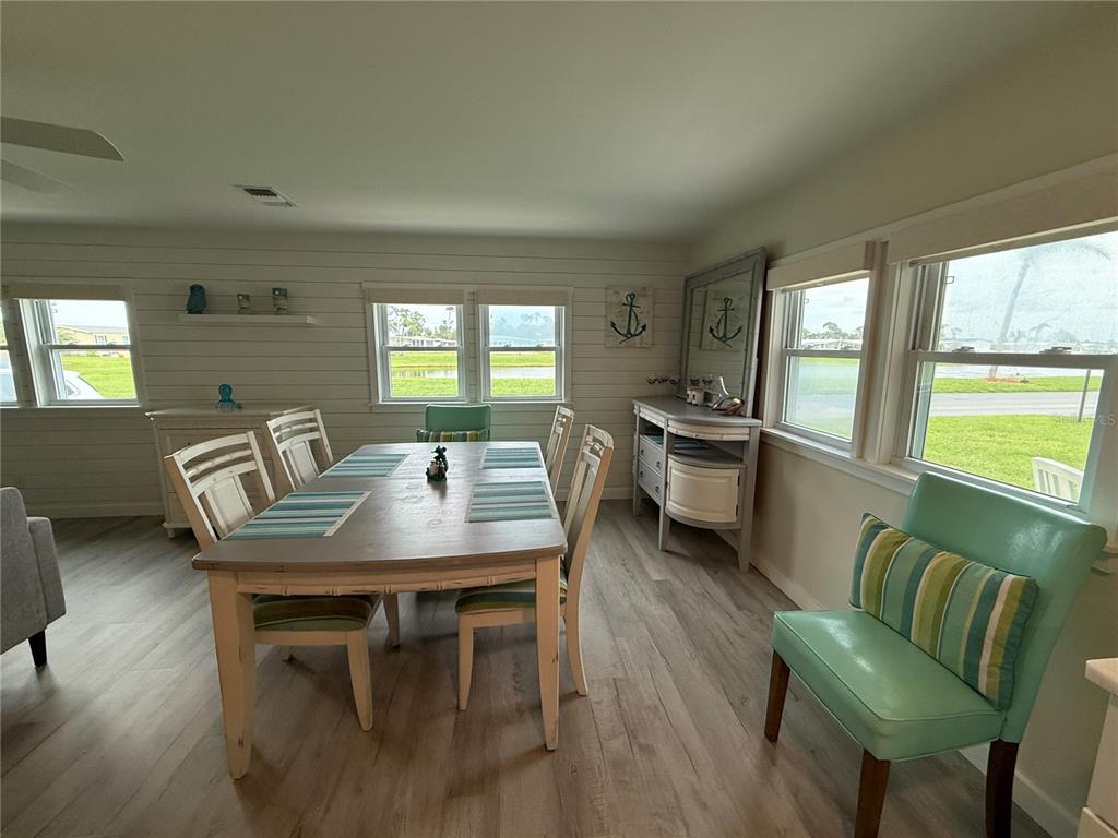 637 Los Altos, Unit 374 North Port, FL 34287 - Photo 6 of 26 a view of a dining room with furniture and a large window