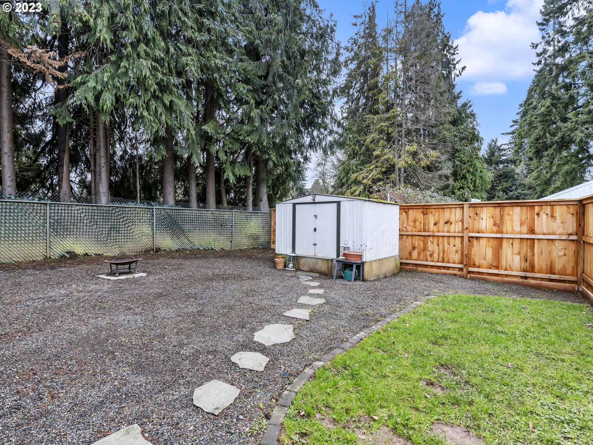 8035 Southeast Pleasant Home Road Gresham, OR 97080 - Photo 25 of 27 a view of a backyard with a barn and a large tree