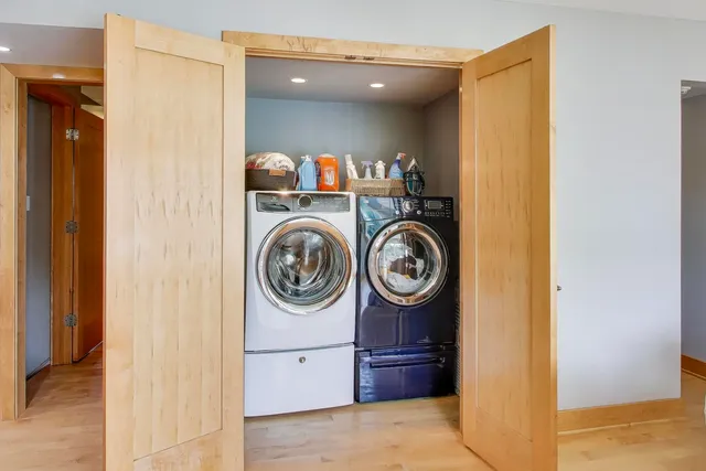 a view of a hallway with washer and dryer