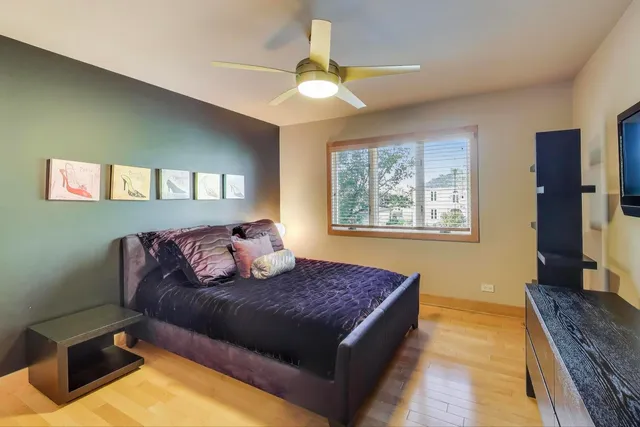 a living room with a couch and a chandelier