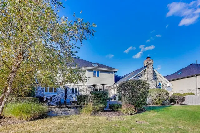 a view of a patio with table and chairs and potted plants