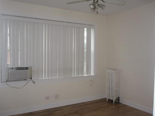 4540 West George Street, Unit 1 Chicago, IL 60641 - Photo 6 of 10 a view of an empty room with a window