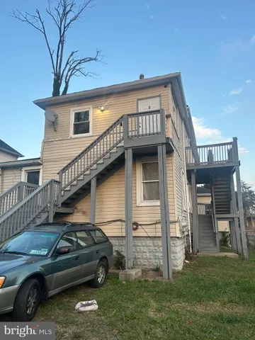 a view of a car in front of house