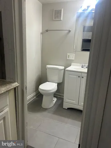 a bathroom with a toilet and a sink