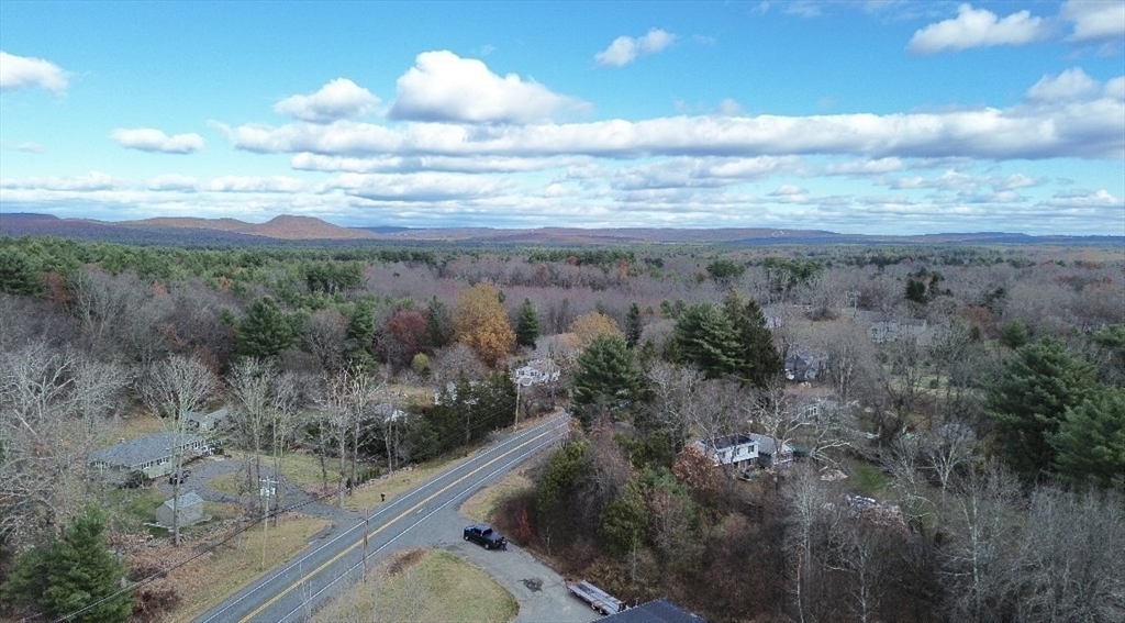 Lot 8 East State Street Granby, MA 01033 - Photo 3 of 16 a view of a yard with an ocean view